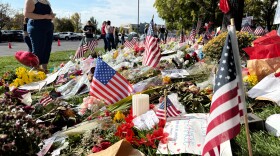 American flags and flowers are displayed at a memorial for Charlie Kirk at Utah Valley University, Monday, Sept. 15, 2025, in Orem, Utah.