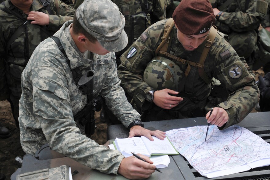 1st Lt. Nathan Meyer, assigned to the 175th Military Police Battalion with the Missouri National Guard, explains the designated route U.S. and Polish soldiers will use to practice route reconnaissance during the Anakonda 16 exercise near Chelmno, Poland.