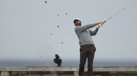 Scottie Scheffler of the United States plays his tee shot on the 6th tee during the first round of the British Open golf championship at the Royal Portrush Golf Club, Northern Ireland, Thursday, July 17, 2025. (AP Photo/Peter Morrison)