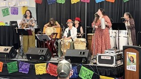 Mala Maña entertains attendees at the April 25 "Voces de Comunidad" event in Albuquerque, organized by the Si Se Puede Committee.