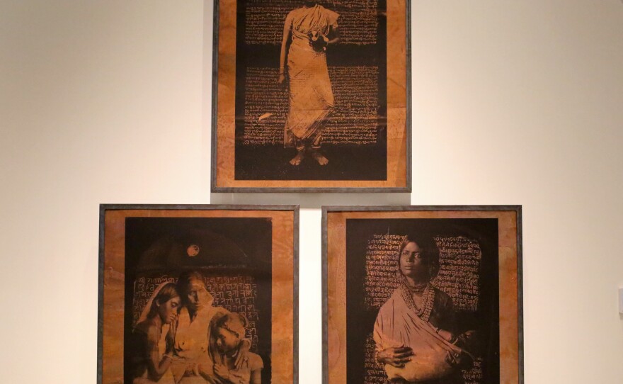 A piece showing portraits of three unnamed Dalit women is called "We are still here." Their images are juxtaposed against legal texts from the 19th century governing their lives as women and as the lowest caste in Indian society.