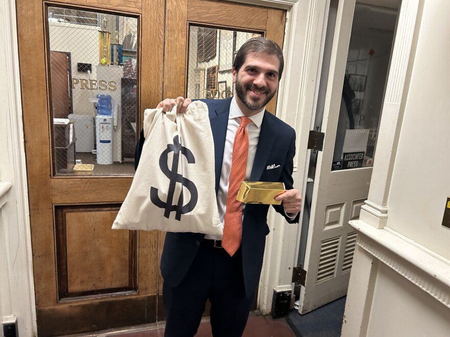 New York state Sen. Andrew Gounardes, a Democrat from Brooklyn, handed out fake gold bars filled with chocolate in the state Capitol's pressroom in Albany.