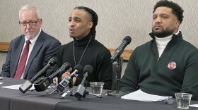 Robert Brooks Jr. speaks during a news conference as his lawyer Steve Schwarz, left, and Jared Ricks listen in Rochester on Wednesday, Jan. 15, 2025.