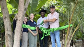 Lee Steiner, owner of Hideaway Farm, cuts the ribbon at the farm's grand opening, along with Louis Petersen, Commissioner of Agriculture, along with Kristin Wilson Grimes and Allie Durdall, Research Associate Professors at the Center of Marine and Environmental Studies at the University of the Virgin Islands.