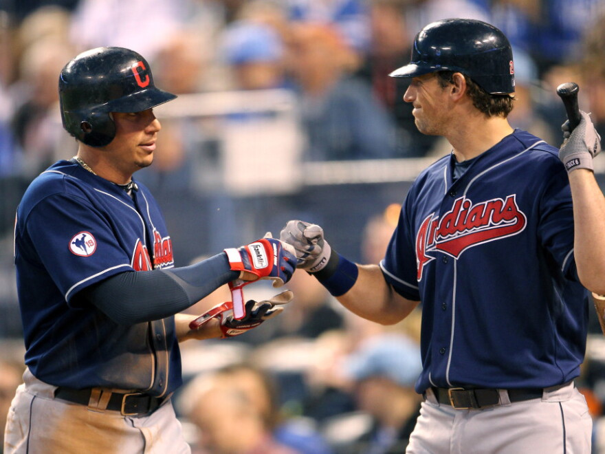 Asdrubal Cabrera (left) leads the resurgent Cleveland Indians in hitting. Here, he's congratulated by Travis Buck after crossing home plate.