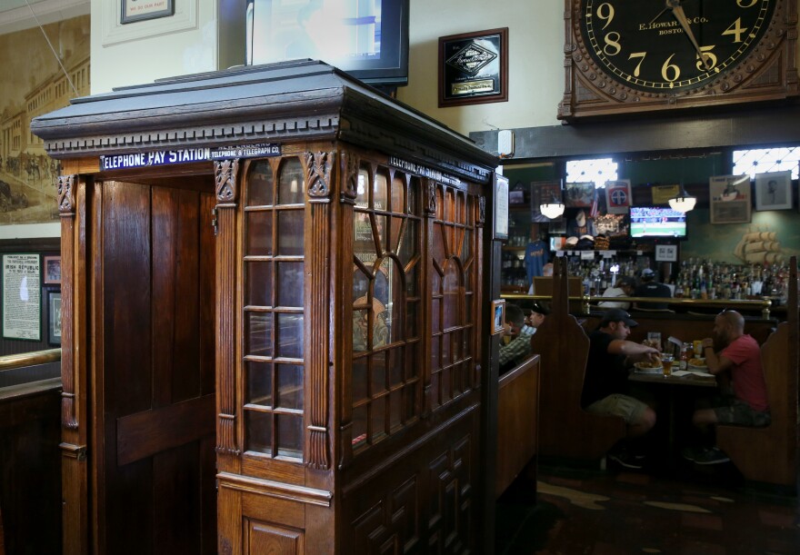 A telephone booth from 1882, which could only be used for receiving calls, is pictured at Doyle's Cafe in Boston, July 21, 2016. It is one of three telephone booths in the restaurant.