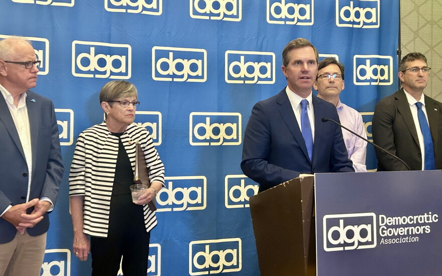 Kentucky Gov. Andy Beshear chairs the Democratic Governors Association. He stands alongside Democratic Governors Tim Walz of Minnesota, Laura Kelly of Kansas, Bob Ferguson of Washington and Matt Meyer of Delaware.