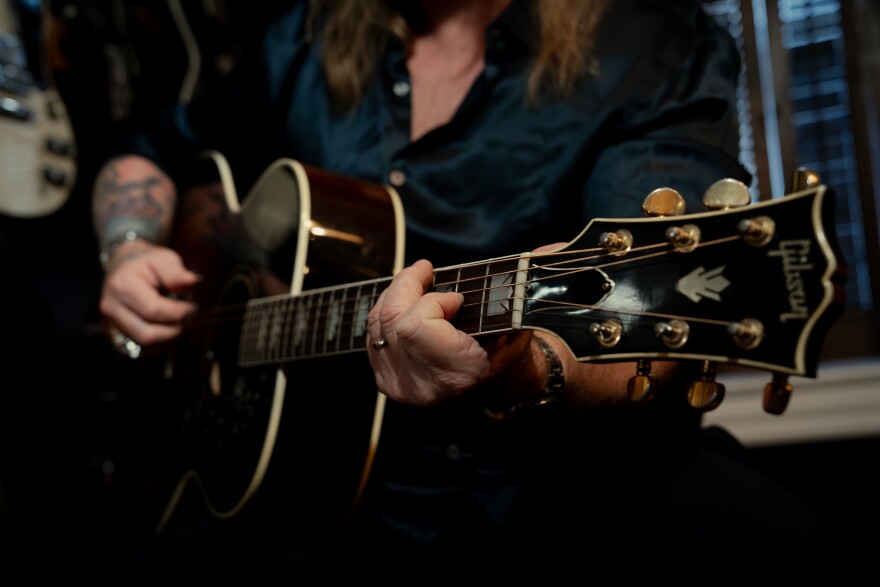 Devon Allman, pictured playing his father Gregg Allman’s guitar in his St. Charles home on Thursday, Nov. 13, 2025, is teaming with Duane Betts to play music of the band their fathers co-founded — the Allman Brothers Band.