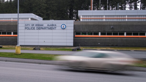 A long exposure of a car driving by the Kodiak Police Department, May 11, 2023.