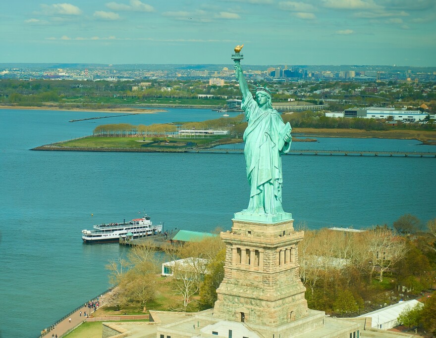 Statue of Liberty with ferry boat