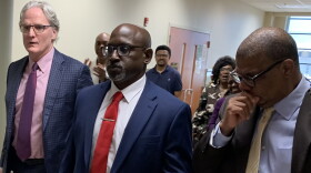 Tulsa police Lt. Marcus Harper, center, walks out of the courtroom after being found not guilty of a shooting cover-up alongside his attorneys Paul DeMuro, left, and Danny Williams on Thursday, June 14, 2024, at the Tulsa County Courthouse.