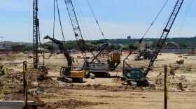 Contractors work on the foundation of the new FCC stadium.