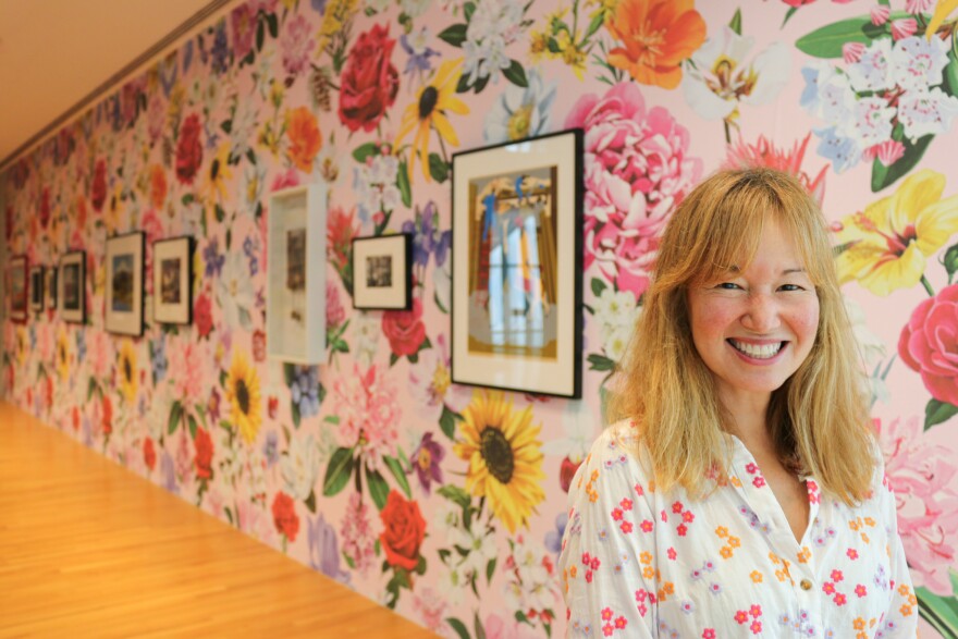 Philippa Pham Hughes at the "Hey, We Need To Talk!" Common Sense Diner. She selected artwork from UMMA's collection and commissioned Detroit-based artist Louise Jones to create the wallpaper, depicting all 50 state flowers.