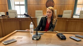 U.S. Rep. Melanie Stansbury talks to reporters after delivering a speech in a joint session of the New Mexico legislature on Jan. 30, 2025.