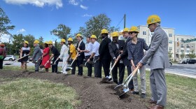 Mayor Brandon Scott and other officials take part in a groundbreaking ceremony Wednesday for a new library branch in Park Heights.