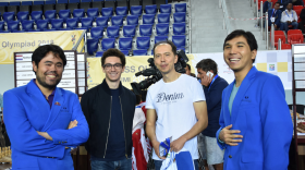 The American "Big Three" at the Batumi Chess Olympiad in Batumi, Georgia in 2018. From left, Hikaru Nakamura, Fabiano Caruana, Caruana's coach, Rustam Kasimjanov, and Wesley So.