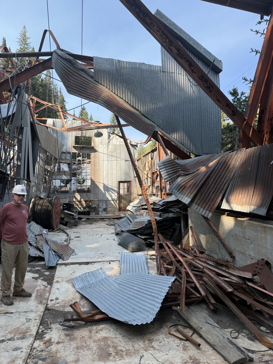 Donald Roll, co-chair of the nonprofit's campaign committee, stands amongst the damage at the Thaynes Mine, July 28, 2025.