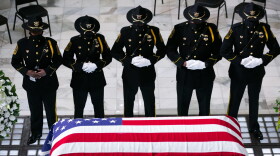 Members of the Fulton County Sheriff's Office Honor Guard stand at attention in front of former US Rep. John Lewis (D-GA) as he lies in state at the Georgia State Capitol on July 29, 2020 in Atlanta, Georgia. (Jessica McGowan/Getty Images)