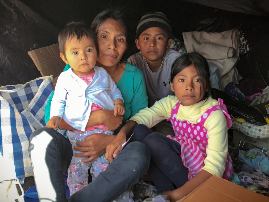 Rosia Ramirez Penaloza and her children fled gang violence in southern Mexico. They're staying in a makeshift tent in San Luis Río Colorado as they wait for a chance to apply for asylum at the port of entry.
