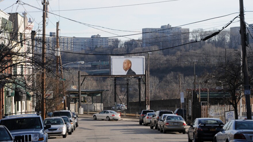 A distant billboard with Strauss' photo of Nathaniel J. Jordan