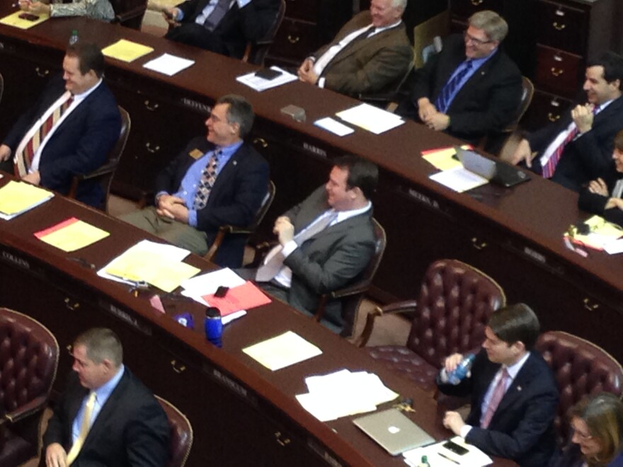 Nate Bell, Charlie Collins, John Burris, and Duncain Baird laugh at jests directed toward colleagues.