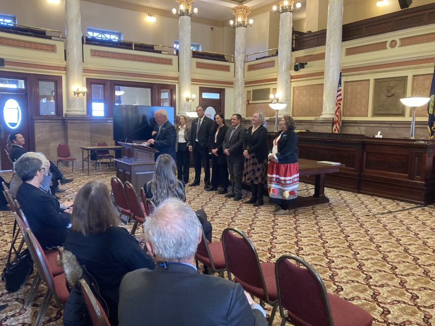 Senator Pat Flowers speaks to Democrats at the Capitol after being elected as Senate minority leader, with House and Senate minority whips standing behind him.