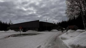 Silhouette of a school building with a dusk sky.