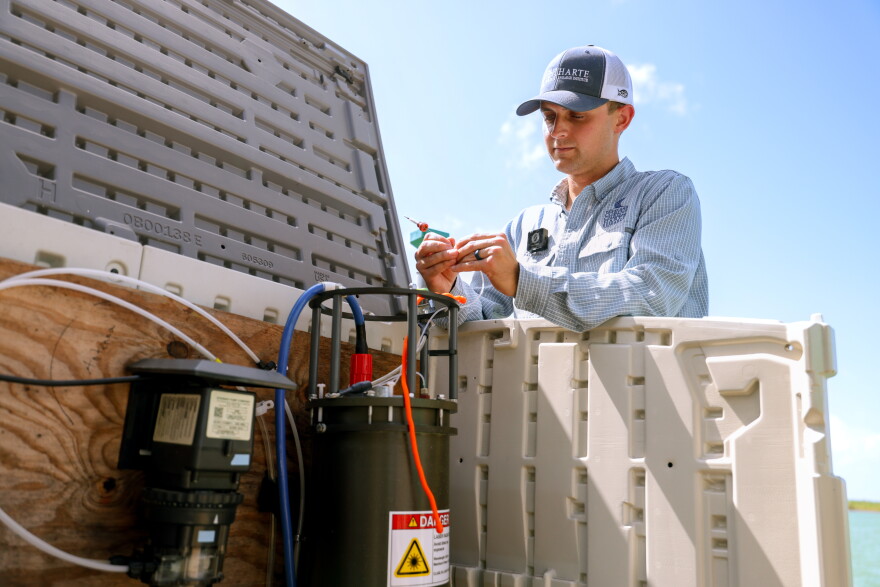 Dalton Tryba, a research specialist at Harte Research Institute (HRI) at Texas A&M University-Corpus Christi, works on a imaging flowcytobot. HRI partners with institutions across the state, like Texas Parks and Wildlife Department, to early detect, and notify others about, harmful algal blooms using artificial intelligence models and advanced underwater imaging.