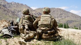 US soldiers look out over hillsides during a visit of the commander of US and NATO forces in Afghanistan General Scott Miller at the Afghan National Army (ANA) checkpoint in Nerkh district of Wardak province.