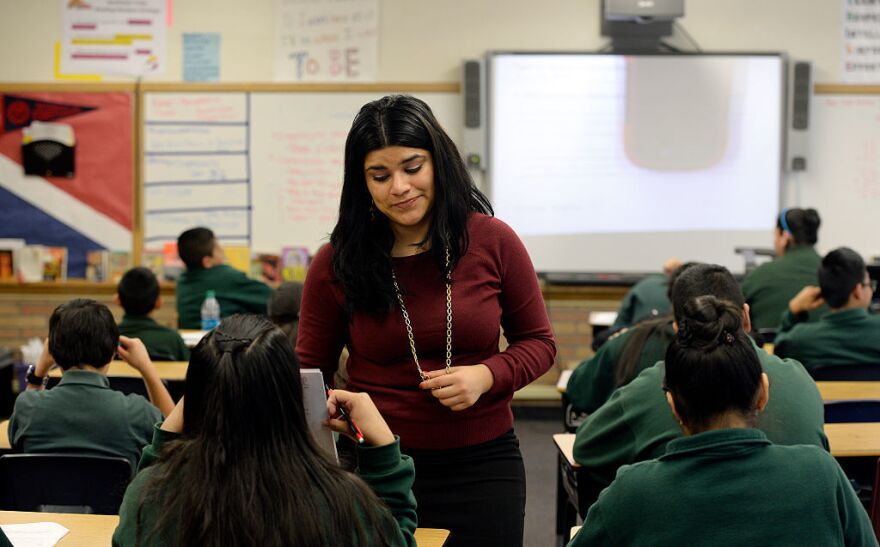 Seventh-grade English teacher Kareli Lizárraga works with her students at STRIVE Prep-Sunnyside in Denver. She came to the United States illegally as a 4-year-old, and works in Denver thanks to the Deferred Action for Childhood Arrivals (DACA) program.
