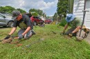 Kevin Klatt, Lee Houser and Brian Condel each search an area containing metal.