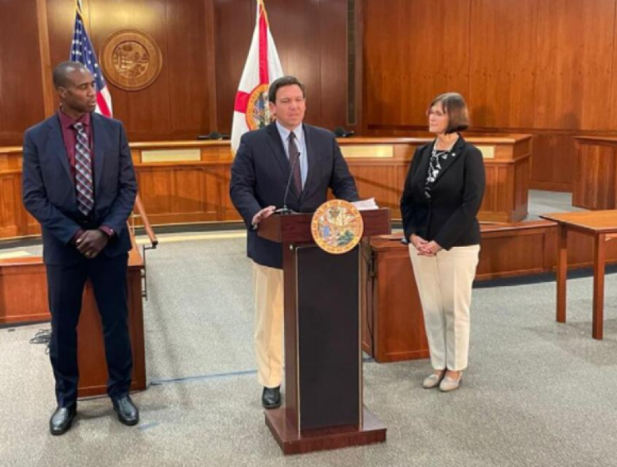 Gov. Ron DeSantis, flanked by Surgeon General Joseph Ladapo and state Rep. Cyndi Stevenson, announced Florida will challenge federal vaccination requirements. (Tom Urban/News Service Florida)