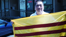 Kim-Long Nguyen displays the national flag of Vietnam prior to the war.