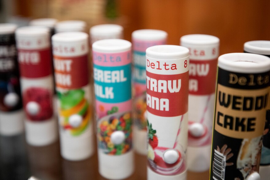 Delta-8 THC vape cartridges are pictured on store shelves.