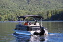 A team of researchers with the UNH Lakes Lay Monitoring Program heads out to track water quality on Lake Kanasatka in Moultonborough Thursday, Sept. 24. At the helm is lakeshore resident Kevin Kelly, who has helped measure water quality on the lake for decades. (NH Bulletin photo)