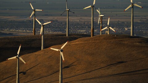 Wind turbines work in Livermore, Calif., Aug. 10, 2022. 