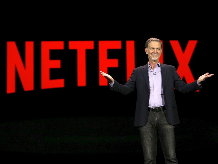 Netflix CEO Reed Hastings delivers a keynote address at the 2016 CES trade show in Las Vegas. Big entertainment rival Disney could challenge the service that made binge-watching popular.