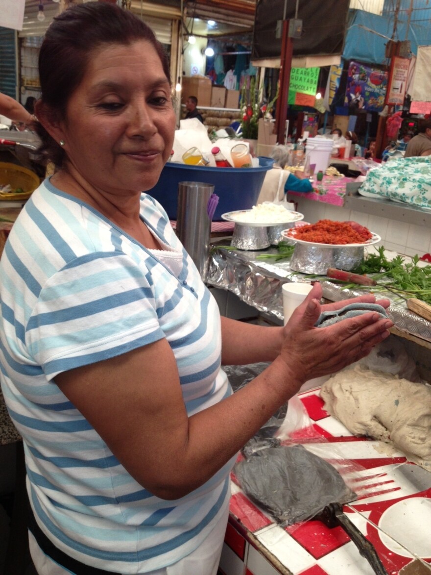 Isabel Salazar Cabrera says her <em>tlacoyos</em> are the best because of the way she cooks the bean filling. She says her mom was the first to ever sell tlacoyos in Xochimilo, a suburb in southern Mexico City.