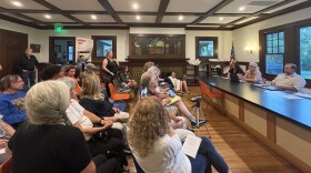 A packed crowd attended Woodstock's town board meeting Tuesday night to protest the town's hiring of a Level 3 sex offender earlier this year. Members of the board say they were unaware of the employee's criminal record. 