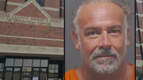 Mugshot of Brad Simpson with Bexar County Adult Detention Center in background