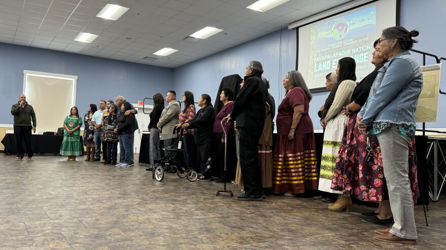 Former Yavapai-Apache Nation Chairman Jon Huey (left) invites past and present council members to stand before the crowd at the Tunlii Community Center.