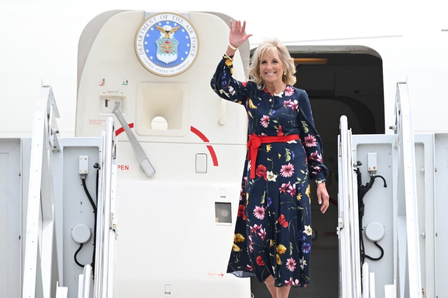 First lady Jill Biden waves as she walks off the plane upon arriving in Savannah, Ga., on July 8, 2021. She was injured while stepping on an object in Hawaii last weekend.