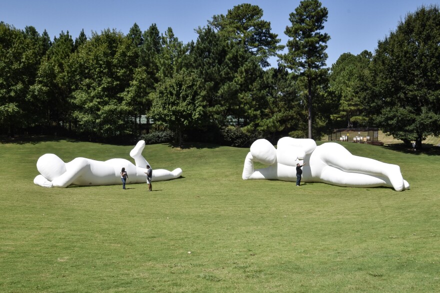 Visitors check out "Fantastic Planet" in Ballantyne's Backyard during the 2023 Charlotte International Arts Festival.