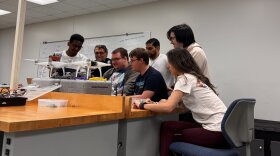 Professor Abdulrahman Yarali and a group of students work with drones.