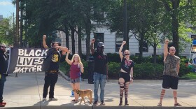 Protesters call for action outside the Allen County Courthouse in response to the police-action shooting of 22-year-old Linzell Parhm.