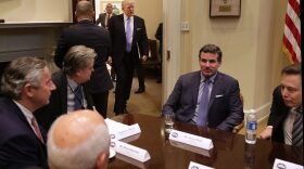 President Trump walks into the Roosevelt Room for a meeting with Mark Sutton of International Paper, Jeff Fettig of Whirlpool, White House Senior Counselor Steve Bannon, Kevin Plank of Under Armour, Elon Musk of SpaceX (left) and other other business leaders at the White House on Jan. 23, 2017 in Washington, D.C. (Chip Somodevilla/Getty Images)