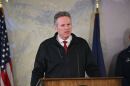 Gov. Mike Dunleavy addresses reporters at a news conference on Monday, Oct. 13, 2025.