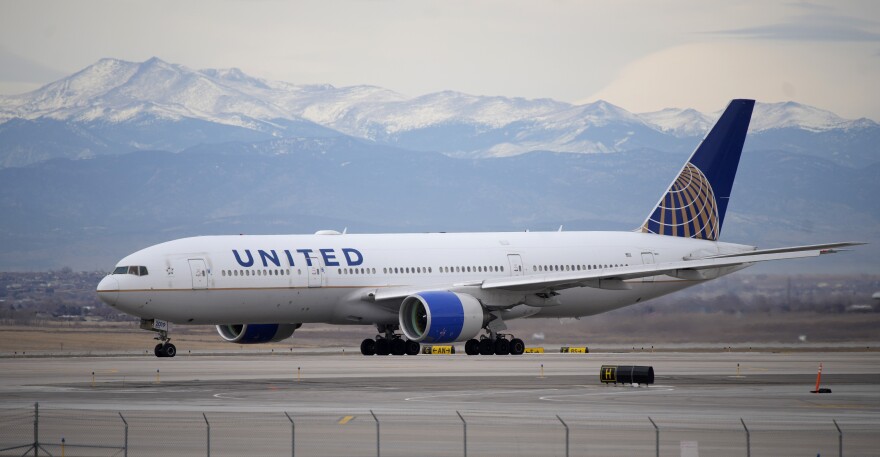 A United Airlines jetliner taxis to a runway for take off from Denver International Airport, Dec. 27, 2022.