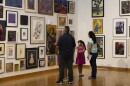 People look at art in a gallery .