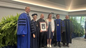USU leaders and Father Rick Lawson celebrate the university's first established deanship
